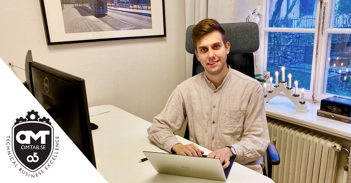 Co-worker at office desk behind computer.